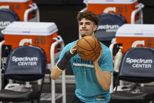 Charlotte Hornets guard LaMelo Ball, wearing a cast on his fractured right wrist, shoots before an NBA basketball game between the Charlotte Hornets and the Atlanta Hawks in Charlotte, N.C., Sunday, April 11, 2021. (AP Photo/Nell Redmond)