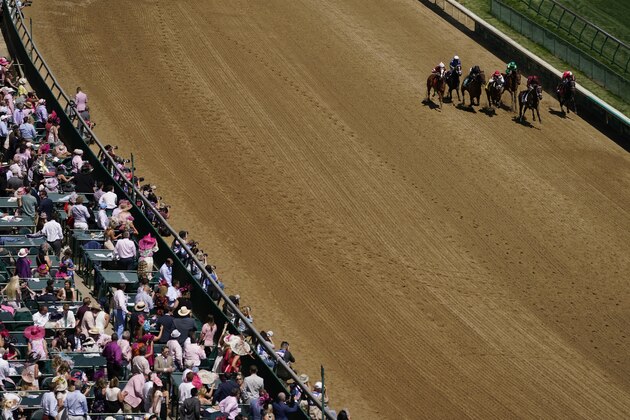 Horses run in race nine before the 147th running of the Kentucky Oaks at Churchill Downs, Friday, April 30, 2021, in Louisville, Ky. (AP Photo/Charlie Riedel)