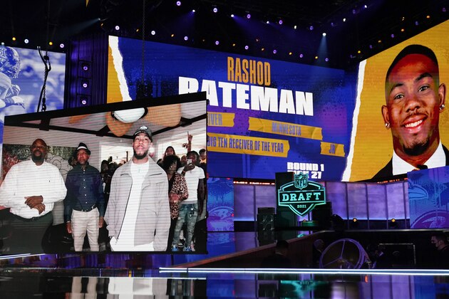 Images of Minnesota wide receiver Rashod Bateman are displayed on stage after he was chosen by the Baltimore Ravens with the 27th pick in the first round of the NFL football draft Thursday April 29, 2021, in Cleveland. (AP Photo/Tony Dejak)