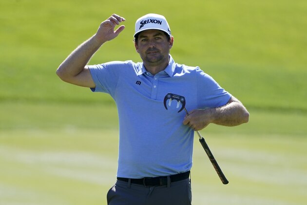 Keegan Bradley reacts after missing a putt on the ninth hole during the first round of the The Players Championship golf tournament Thursday, March 11, 2021, in Ponte Vedra Beach, Fla. (AP Photo/John Raoux)