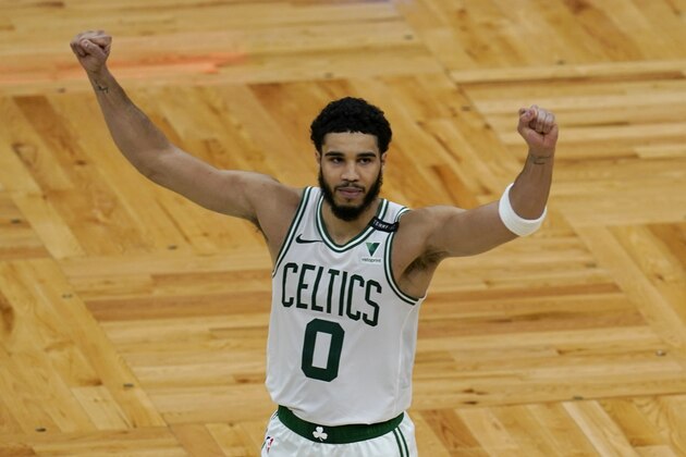 Boston Celtics forward Jayson Tatum (0) celebrates after an NBA basketball game against the San Antonio Spurs, Friday, April 30, 2021, in Boston. Tatum scored 60 points to lead the Celtics to a 143-140 victory in overtime. (AP Photo/Elise Amendola)