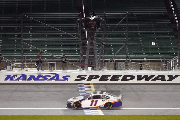 Denny Hamlin (11) wins a NASCAR Cup Series auto race at Kansas Speedway in Kansas City, Kan., Thursday, July 23, 2020. (AP Photo/Charlie Riedel)
