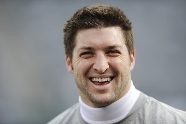New York Jets quarterback Tim Tebow smiles before an NFL football game against the San Diego Chargers, Sunday, Dec. 23, 2012 in East Rutherford, N.J. (AP Photo/Bill Kostroun)