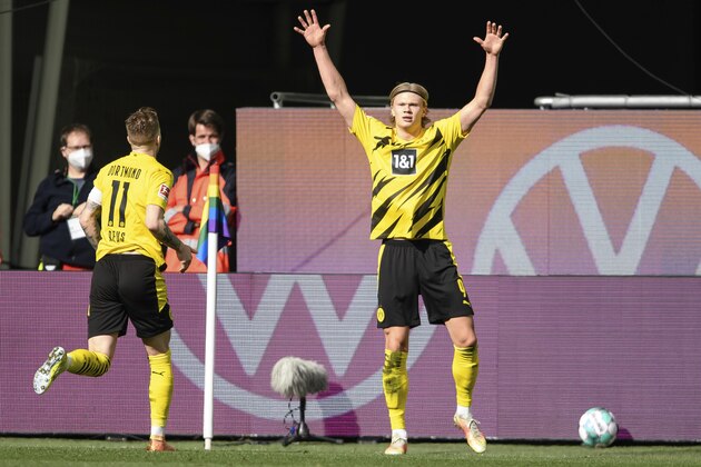 Dortmund's Erling Haaland celebrates his 2nd goal during a German Bundesliga soccer match between VfL Wolfsburg and Borussia Dortmund in Wolfsburg, Germany, Saturday, April 24, 2021. (Swen Pfoertner/dpa via AP)