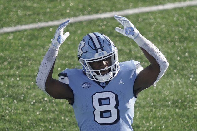 North Carolina running back Michael Carter (8) reacts during the second half of an NCAA college football game against Wake Forest in Chapel Hill, N.C., Saturday, Nov. 14, 2020. (AP Photo/Gerry Broome)
