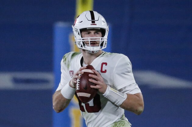 Stanford quarterback Davis Mills (15) looks for a receiver against the UCLA during the second half of an NCAA college football game Saturday, Dec. 19, 2020, in Pasadena, Calif. The Stanford won 48-47 in overtime. (AP Photo/Ringo H.W. Chiu)