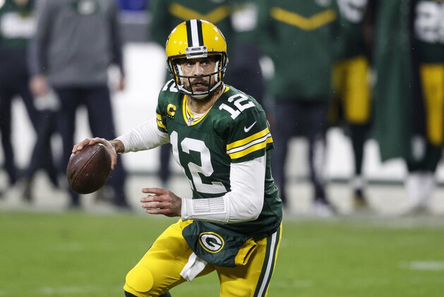 Green Bay Packers quarterback Aaron Rodgers (12) looks to throw during an NFL divisional playoff football game between the Los Angeles Rams and Green Bay Packers, Saturday, Jan. 16, 2021, in Green Bay, Wis. (AP Photo/Jeffrey Phelps)