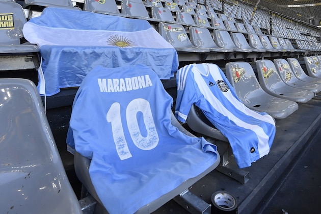 Diego Maradona jersey is displayed on the stands ahead of the German Bundesliga soccer match between Borussia Dortmund and 1.FC Cologne in Dortmund, Germany, Saturday, Nov. 28, 2020. (AP Photo/Martin Meissner, Pool)