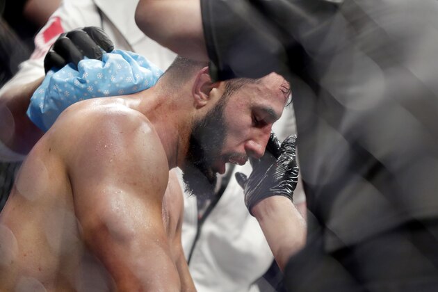Dominick Reyes is tended to in his corner between rounds during a light heavyweight mixed martial arts bout against Jon Jones at UFC 247 Sunday, Feb. 9, 2020, in Houston. (AP Photo/Michael Wyke)
