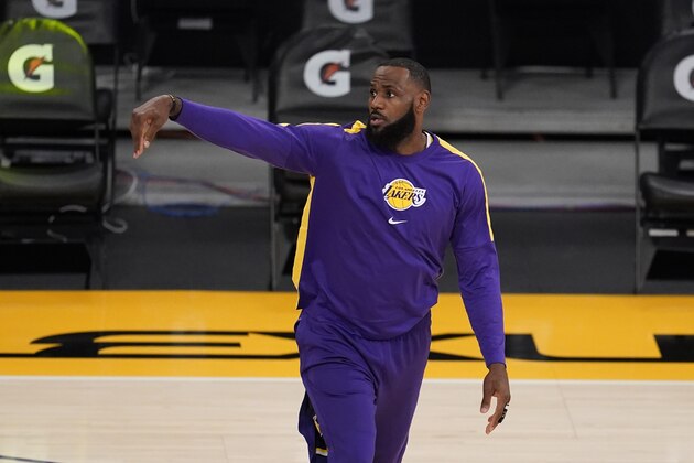 Los Angeles Lakers' LeBron James warms up before the team's NBA basketball game against the Sacramento Kings on Friday, April 30, 2021, in Los Angeles. (AP Photo/Marcio Jose Sanchez)