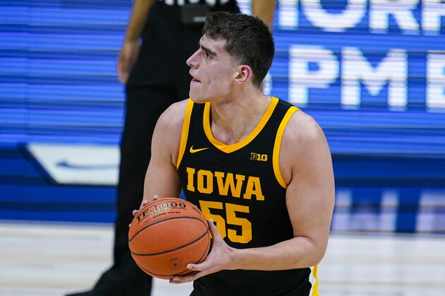 Iowa center Luka Garza (55) plays against Illinois in the first half of an NCAA college basketball game at the Big Ten Conference tournament in Indianapolis, Saturday, March 13, 2021. (AP Photo/Michael Conroy)