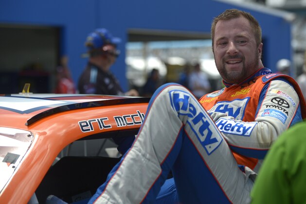 Eric McClure gets out of his car after finishing his laps during qualifying for the NASCAR Nationwide auto race at Daytona International Speedway in Daytona Beach, Fla., Friday, July 5, 2013.(AP Photo/Phelan M. Ebenhack)