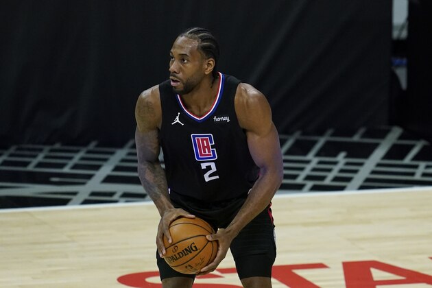 Los Angeles Clippers forward Kawhi Leonard (2) controls the ball during an NBA basketball game against the Denver Nuggets Thursday, April 1, 2021, in Los Angeles. (AP Photo/Ashley Landis)