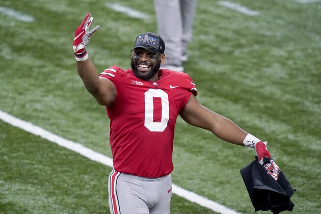 Ohio State defensive end Jonathon Cooper celebrates following the Big Ten championship NCAA college football game against Northwestern, Saturday, Dec. 19, 2020, in Indianapolis. Ohio State won 22-10. (AP Photo/Darron Cummings)