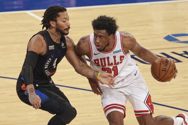 Chicago Bulls forward Thaddeus Young (21) drives to the basket against New York Knicks guard Derrick Rose (4) during the third quarter of an NBA basketball game Wednesday, April 28, 2021, in New York. (Vincent Carchietta/Pool Photo via AP)