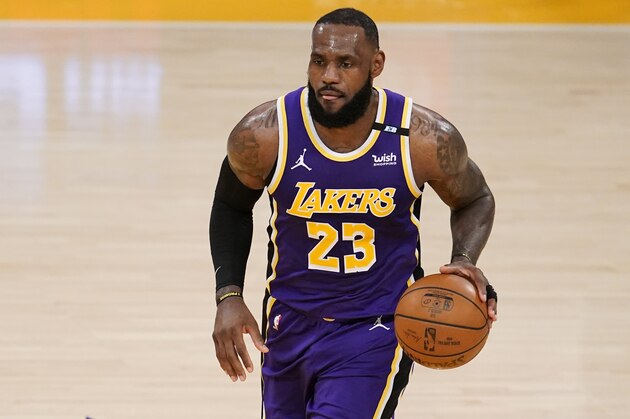 Los Angeles Lakers forward LeBron James dribbles during the first half of an NBA basketball game against the Sacramento Kings Friday, April 30, 2021, in Los Angeles. (AP Photo/Marcio Jose Sanchez)