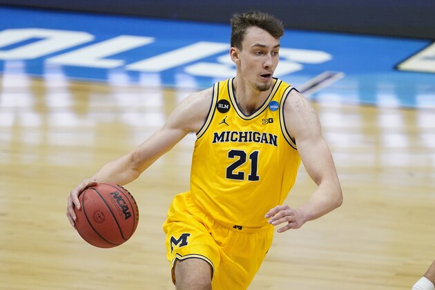 Michigan guard Franz Wagner drives up court during the first half of an Elite 8 game against UCLA in the NCAA men's college basketball tournament at Lucas Oil Stadium, Tuesday, March 30, 2021, in Indianapolis. (AP Photo/Darron Cummings)