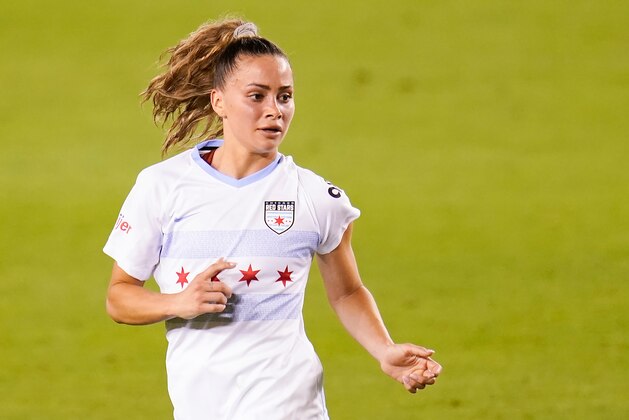 Chicago Red Stars defender Sarah Gorden (11) runs upfield during an NWSL Challenge Cup soccer match, Friday, April 9, 2021, in Houston. (AP Photo/Matt Patterson)