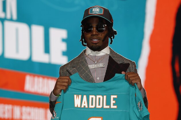 Alabama wide receiver Jaylen Waddle holds a team jersey after being chosen by the Miami Dolphins with the sixth pick in the NFL football draft Thursday April 29, 2021, in Cleveland. (Jeff Haynes/AP Images for Panini)