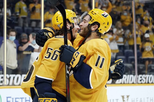 Nashville Predators left wing Erik Haula (56) celebrates with Luke Kunin (11) after Haula scored the winning goal against the Dallas Stars in overtime of an NHL hockey game Saturday, May 1, 2021, in Nashville, Tenn. The Predators won 1-0.(AP Photo/Mark Humphrey)