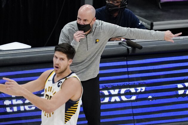 Indiana Pacers head coach Nate Bjorkgren directs his team behind Indiana Pacers forward Doug McDermott (20) during the second half of a basketball game against the Washington Wizards, Monday, May 3, 2021, in Washington. (AP Photo/Alex Brandon)