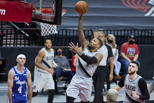Portland Trail Blazers guard Damian Lillard shoots against the Los Angeles Lakers during the second half of an NBA basketball game in Portland, Ore., Friday, May 7, 2021. (AP Photo/Craig Mitchelldyer)