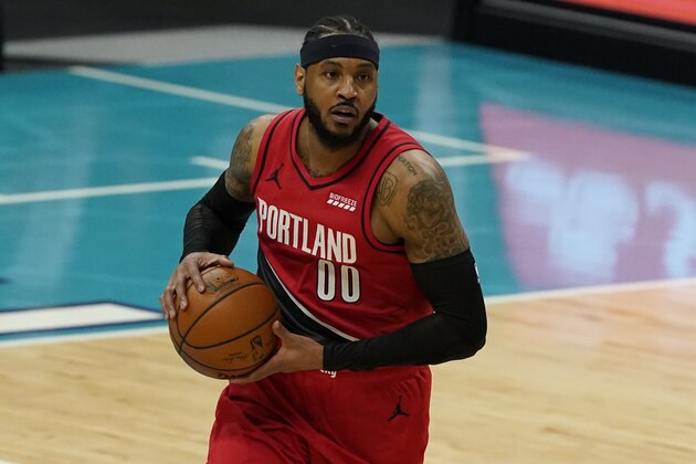 Portland Trail Blazers forward Carmelo Anthony brings the ball down court against the Charlotte Hornets during the first half in an NBA basketball game on Sunday, April 18, 2021, in Charlotte, N.C. (AP Photo/Chris Carlson)