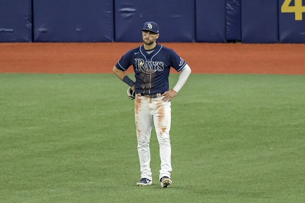 Tampa Bay Rays' Kevin Kiermaier stands in center field after his throw to home plate was not in time to prevent Oakland Athletics' Matt Olson scoring from third on Mitch Moreland's sacrifice fly during the sixth inning of a baseball game Tuesday, April 27, 2021, in St. Petersburg, Fla. (AP Photo/Steve Nesius)