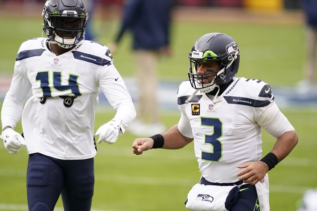 Seattle Seahawks wide receiver DK Metcalf (14) and quarterback Russell Wilson (3)before the start of an NFL football game against the Washington Football Team, Sunday, Dec. 20, 2020, in Landover, Md. (AP Photo/Andrew Harnik)