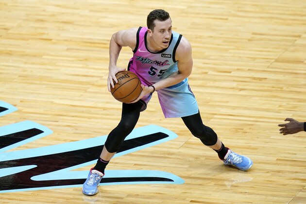 Miami Heat guard Duncan Robinson (55) looks to pass during the first half of an NBA basketball game against the San Antonio Spurs, Wednesday, April 28, 2021, in Miami. (AP Photo/Lynne Sladky)