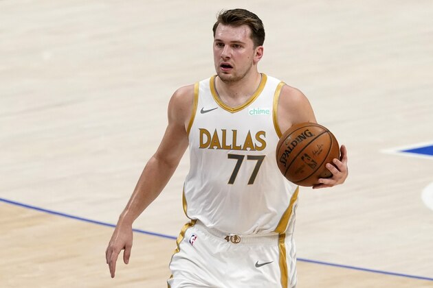 Dallas Mavericks' Luka Doncic advances the ball up court during an NBA basketball game against the Brooklyn Nets in Dallas, Thursday, May 6, 2021. (AP Photo/Tony Gutierrez)