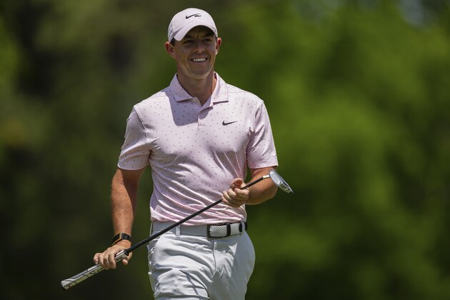 Rory McIlroy smiles after his putt on the third hole during the fourth round of the Wells Fargo Championship golf tournament at Quail Hollow on Sunday, May 9, 2021, in Charlotte, N.C. (AP Photo/Jacob Kupferman)