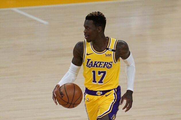 Los Angeles Lakers guard Dennis Schroder (17) controls the ball during an NBA basketball game against the Milwaukee Bucks Wednesday, March 31, 2021, in Los Angeles. (AP Photo/Ashley Landis)