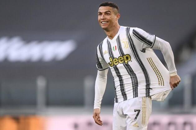 Juventus' Cristiano Ronaldo shows the referee how he was fouled during the Italian Serie A soccer match between Juventus and Napoli at the Allianz Stadium in Turin, Italy, Wednesday, April 7, 2021. (Fabio Ferrari/LaPresse via AP)