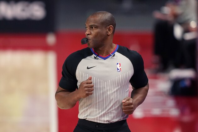 Referee Tony Brown runs on the sideline during the first half of an NBA basketball game between the Detroit Pistons and the Toronto Raptors, Wednesday, March 17, 2021, in Detroit. (AP Photo/Carlos Osorio)