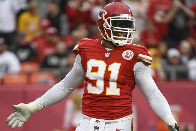 Kansas City Chiefs outside linebacker Tamba Hali (91) celebrates a play during the second half of their NFL football game against the Oakland Raiders in Kansas City, Mo., Sunday, Dec. 14, 2014. (AP Photo/Reed Hoffmann)