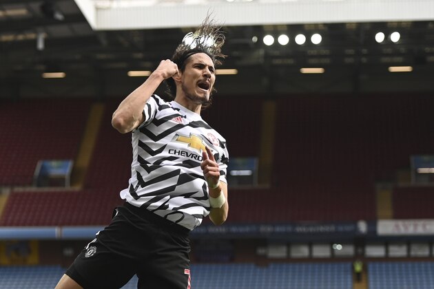 Manchester United's Edinson Cavani celebrates after scoring his side's third goal during the English Premier League soccer match between Aston Villa and Manchester United at Villa Park in Birmingham, England, Sunday, May 9, 2021. (Shaun Botterill/Pool via AP)