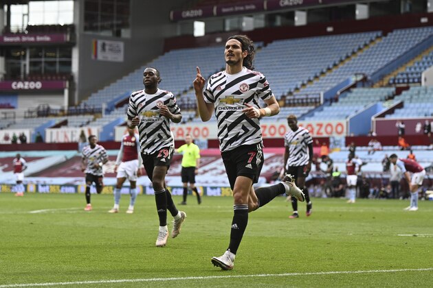 Manchester United's Edinson Cavani celebrates after scoring his side's third goal during the English Premier League soccer match between Aston Villa and Manchester United at Villa Park in Birmingham, England, Sunday, May 9, 2021. (Shaun Botterill/Pool via AP)