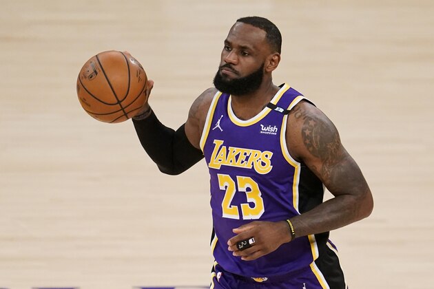 Los Angeles Lakers' LeBron James dribble the ball during the first half of the team's NBA basketball game against the Sacramento Kings on Friday, April 30, 2021, in Los Angeles. (AP Photo/Marcio Jose Sanchez)