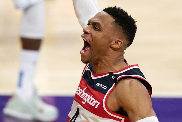 Washington Wizards guard Russell Westbrook celebrates after scoring and drawing a foul in the closing second of overtime in an NBA basketball game against the Los Angeles Lakers Monday, Feb. 22, 2021, in Los Angeles. The Wizards won 127-124 in overtime. (AP Photo/Mark J. Terrill)