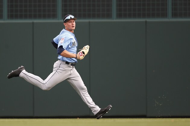 FILE - In this March 9, 2019 file photo, Seattle Mariners' Jarred Kelenic chases a ball during a spring training baseball game in Phoenix. Kelenic is one of the top 20-30 prospects in all of baseball is currently one of the centerpieces of the Mariners' rebuild. (AP Photo/Sue Ogrocki, File)