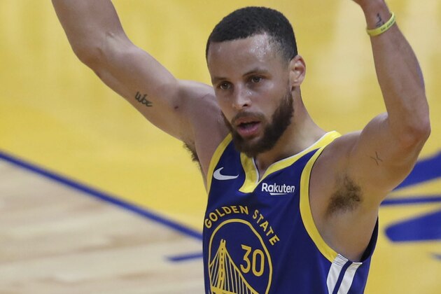 Golden State Warriors' Stephen Curry waves to the crowd after scoring against the Oklahoma City Thunder during the first half of an NBA basketball game in San Francisco, Saturday, May 8, 2021. (AP Photo/Jed Jacobsohn)