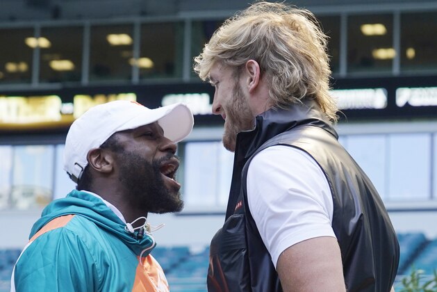Boxers Floyd Mayweather and Logan Paul taunt each other during a news conference Thursday, May 6, 2021, in Miami Gardens, Fla. Mayweather and Paul are scheduled to face off in an exhibition bout June 6. (AP Photo/Marta Lavandier)