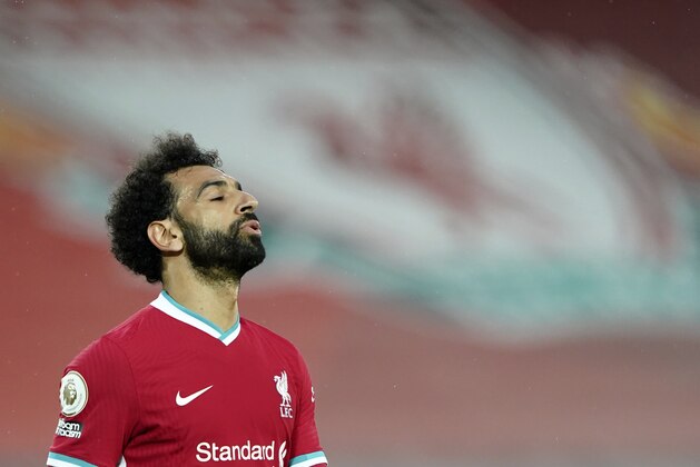 Liverpool's Mohamed Salah reacts after missing a chance to score during the English Premier League soccer match between Liverpool and Southampton at Anfield stadium in Liverpool, England, Saturday, May 8, 2021. (Zac Goodwin/Pool via AP)