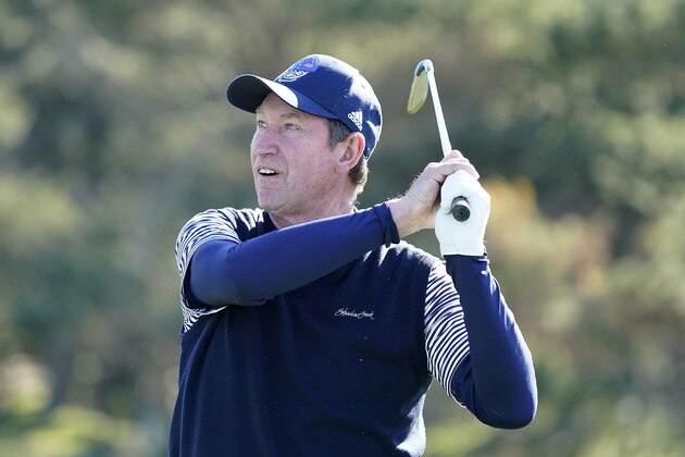 Wayne Gretzky follows his drive from the fifth tee of the Spyglass Hill Golf Course during the first round of the AT&T Pebble Beach National Pro-Am golf tournament Thursday, Feb. 6, 2020, in Pebble Beach, Calif. (AP Photo/Tony Avelar)