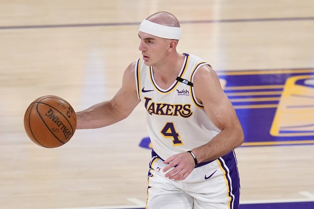 Los Angeles Lakers guard Alex Caruso (4) dribbles during an NBA basketball game against the Phoenix Suns Sunday, May 9, 2021 in Los Angeles. (AP Photo/Marcio Jose Sanchez)