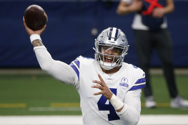 FILE - In this Oct. 11, 2020, file photo, Dallas Cowboys quarterback Dak Prescott throws a pass in the first half of an NFL football game against the New York Giants in Arlington, Texas. The Cowboys and Prescott have finally agreed on a contract two years after negotiations began with the star quarterback. The team the agreement was reached Monday, March 8, 2021, with further details to be announced. (AP Photo/Michael Ainsworth, File)