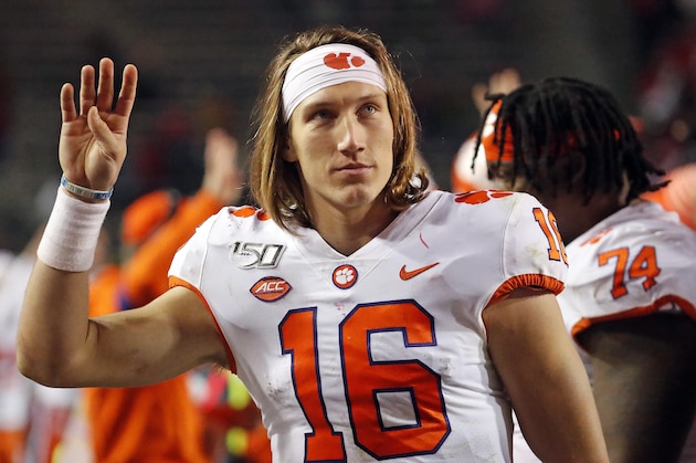 Clemson's Trevor Lawrence (16) waves to someone in the crowd during the second half of an NCAA college football game against North Carolina State in Raleigh, N.C., Saturday, Nov. 9, 2019. (AP Photo/Karl B DeBlaker)
