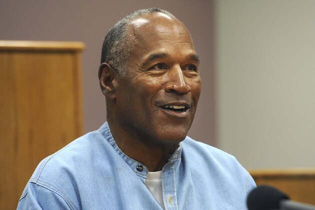 FILE - In this July 20, 2017 file photo, former NFL football star O.J. Simpson appears via video for his parole hearing at the Lovelock Correctional Center in Lovelock, Nev.  A Las Vegas Strip hotel-casino is denying that Simpson was defamed when employees banned him from the property in November 2017 and a celebrity news site reported the paroled former football hero had been drunk, disruptive and unruly. In recent court filings, the Cosmopolitan of Las Vegas rejects Simpsonâ€™s argument that his reputation was damaged by unnamed hotel staff member accounts cited in a TMZ report saying he was prohibited from returning after visits to a steakhouse and cocktail lounge. (Jason Bean/The Reno Gazette-Journal via AP, Pool)