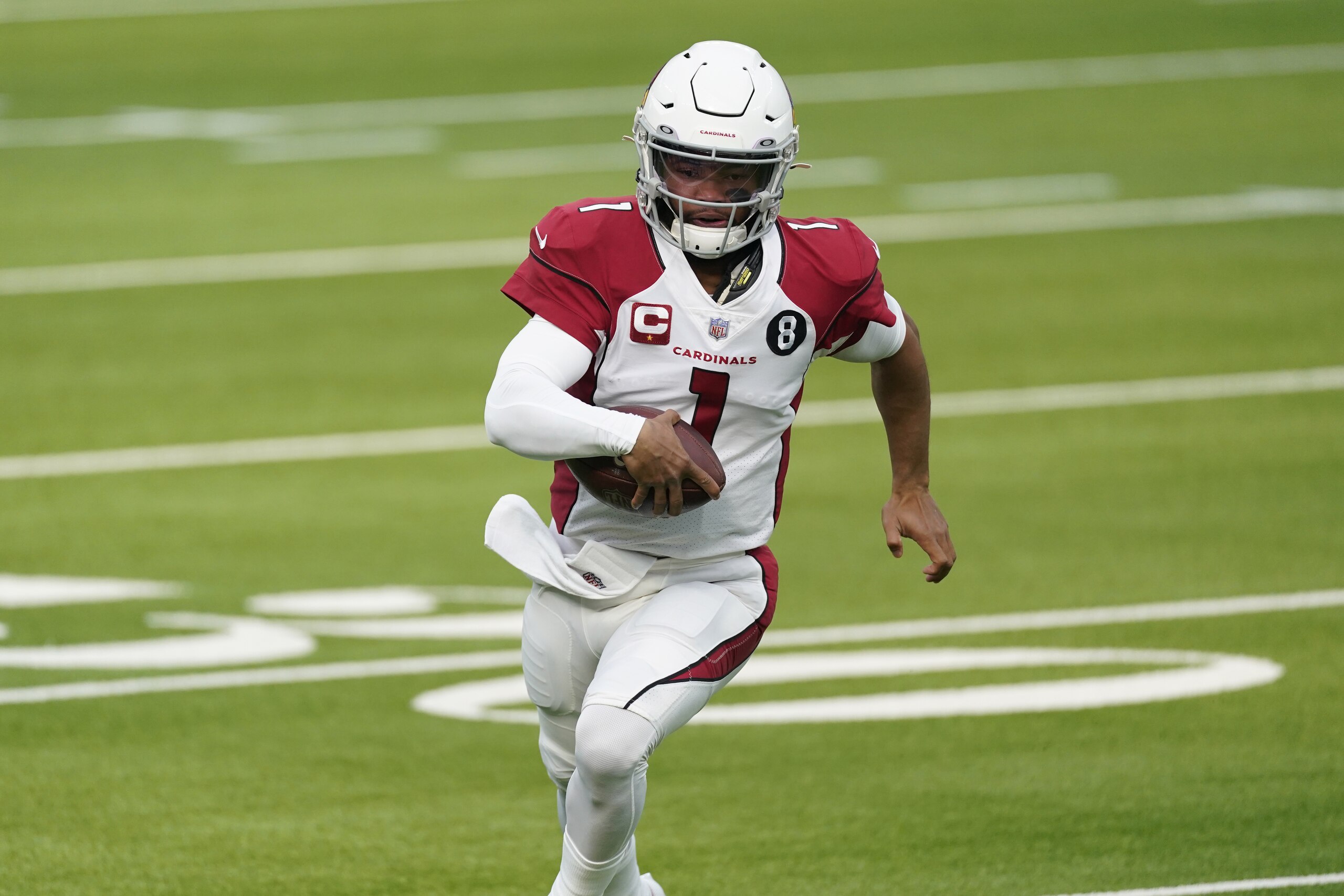 Arizona Cardinals quarterback Kyler Murray (1) runs against the Los Angeles Rams during the first half of an NFL football game in Inglewood, Calif., Sunday, Jan. 3, 2021. (AP Photo/Ashley Landis)